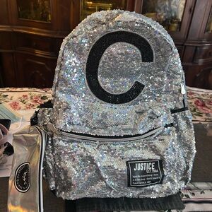 Justice Shimmering Silver Backpack with Black Lettering